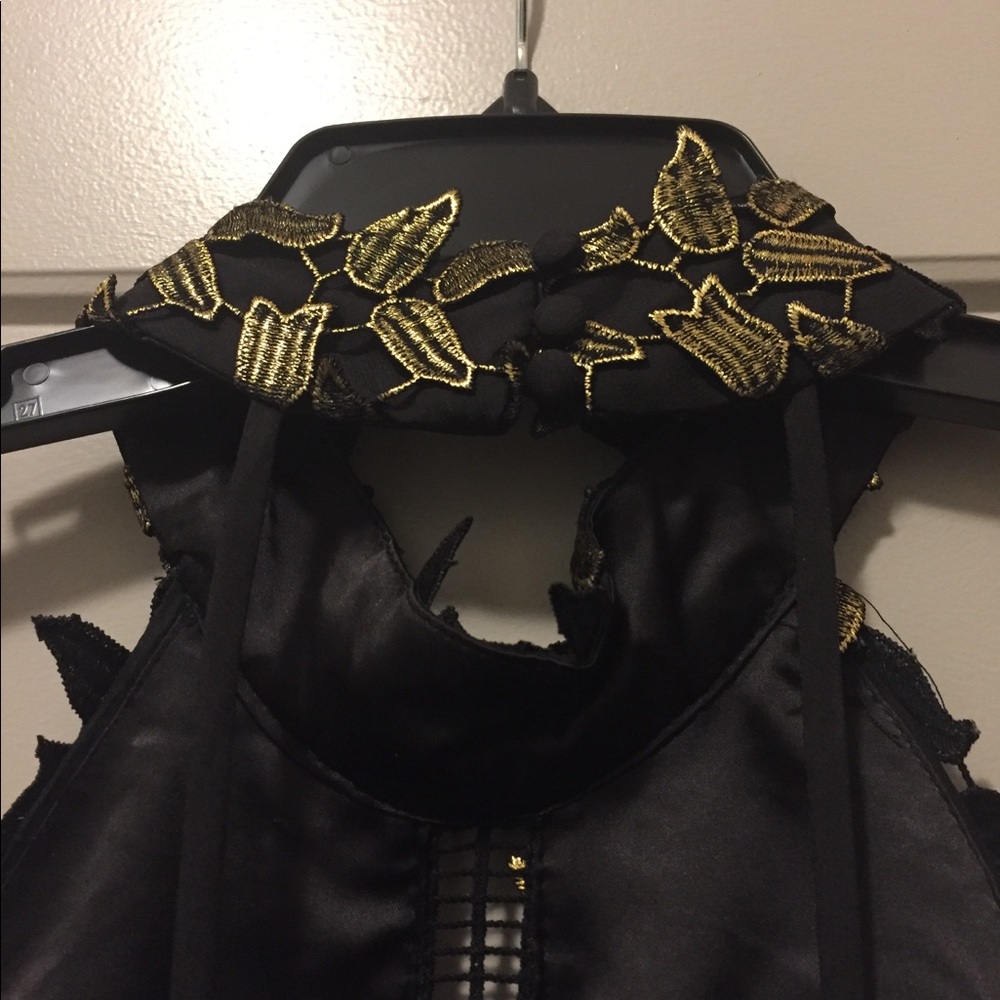 Size 8 black and gold halter dress.